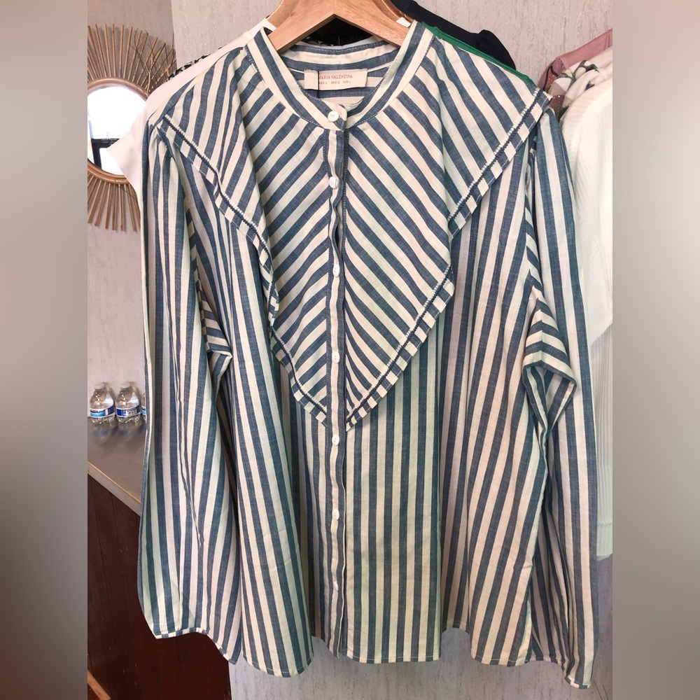 Striped white and blue shirt.
